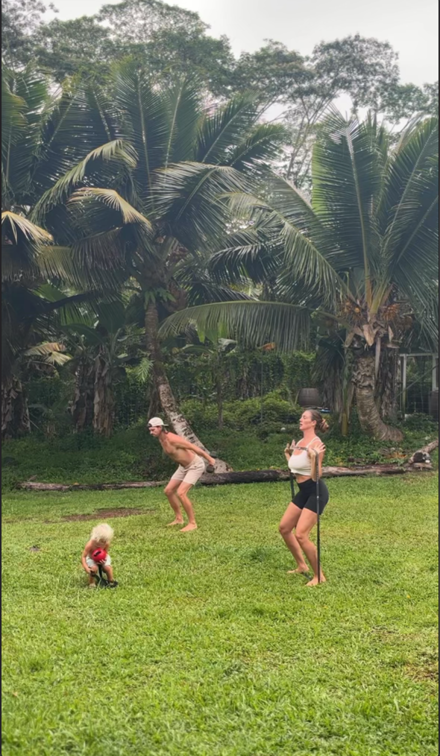 Family of 3 working out in nature barefoot on earth
